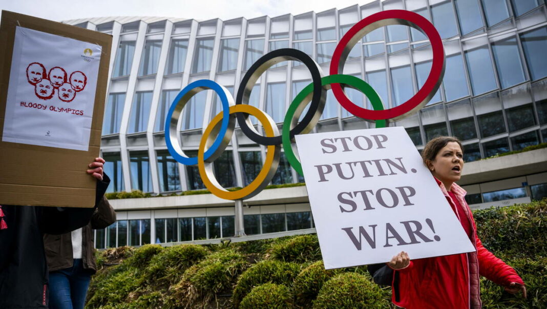 Members of Ukrainian society in Switzerland protest at IOC in Lausanne